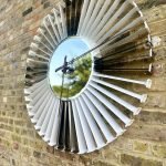 White and Silver clock made from upcycled aviation parts