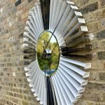 White and Silver clock made from upcycled aviation parts