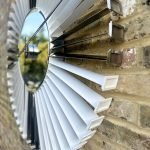 White and Silver clock made from upcycled aviation parts