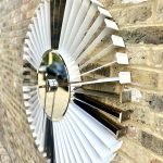 White and Silver clock made from upcycled aviation parts
